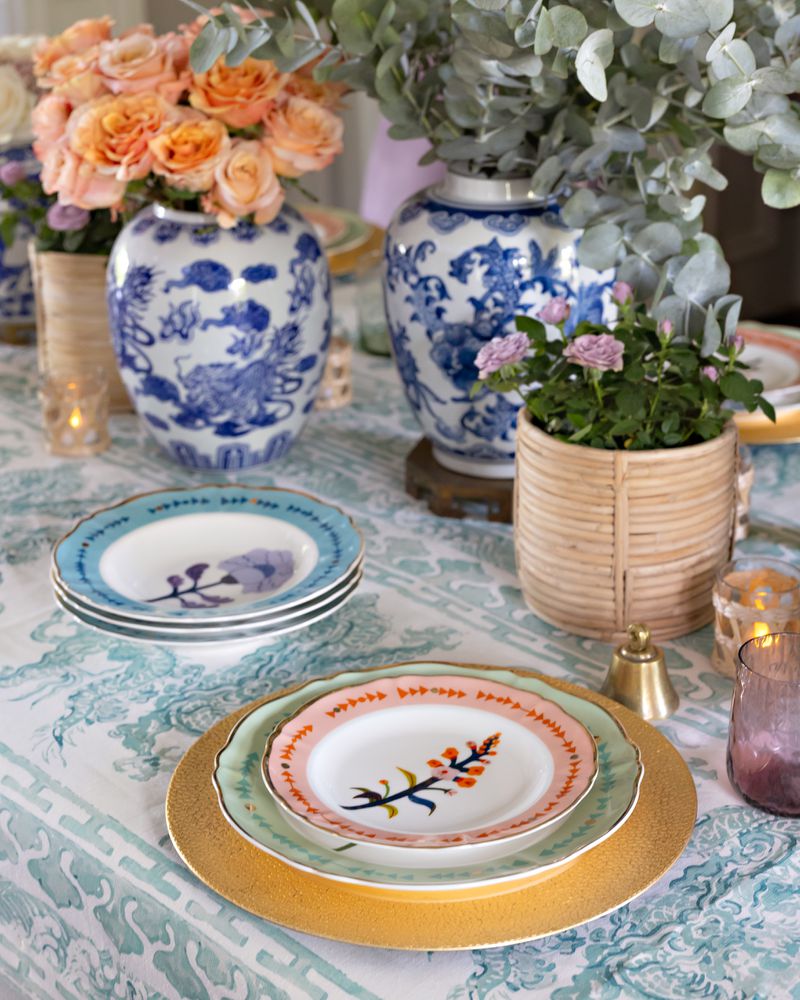 In this dining room, designer Kristin Kong used floral dinner plates, ginger jars and potted fresh flowers for a cleaner, brighter summer look. 
(Courtesy of K Kong Designs / Clara Chambers)