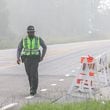 Haze from the BioLab plant chemical fire in Conyers envelops the intersection of Sigman and Rockbridge roads on the morning of Monday, Sept. 30, 2024. (John Spink/AJC)