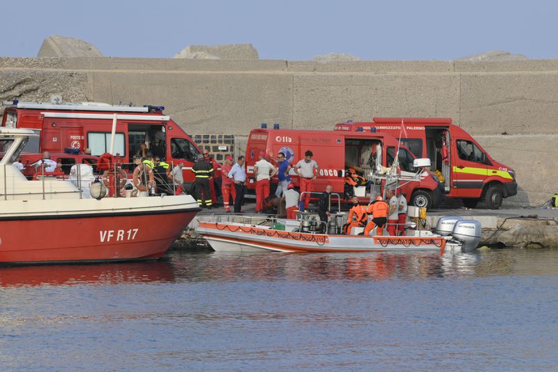 Italian Firefighters scubadivers prepare to sail toward the area where the UK flag vessel Bayesan that was hit by a violent sudden storm, sunk early Monday, Aug. 19, 2024, while at anchor off the Sicilian village of Porticello near Palermo, in southern Italy. (AP Photo/Lucio Ganci)