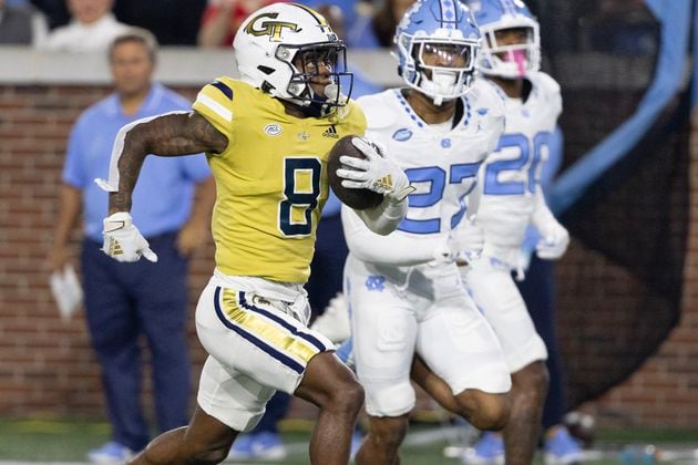 Georgia Tech Yellow Jackets wide receiver Malik Rutherford (8) runs 42 yards on a Haynes King pass to score a touchdown during the second quarter of an NCAA football game In Atlanta on Saturday, Oct. 28, 2023 between the Georgia Tech Yellow Jackets and the North Carolina Tar Heels.  (Bob Andres for the Atlanta Journal Constitution)