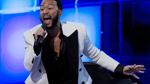 John Legend performs during the Democratic National Convention Wednesday, Aug. 21, 2024, in Chicago. (AP Photo/Paul Sancya)