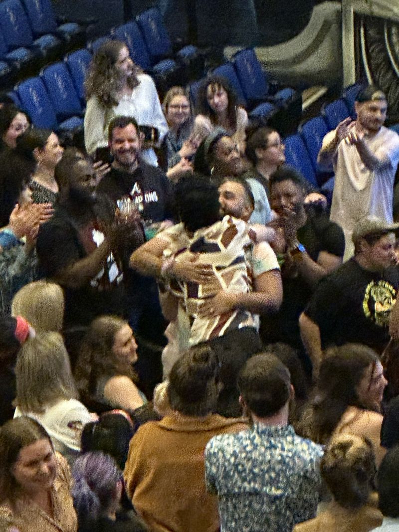 Yamil "Yam Yam" Arocho hugs Matt Blankinship moments after CBS aired Blankinship's elimination on "Survivor" on April 12, 2023 at Ron Clark Academy in Atlanta. RODNEY HO/rho@ajc.com