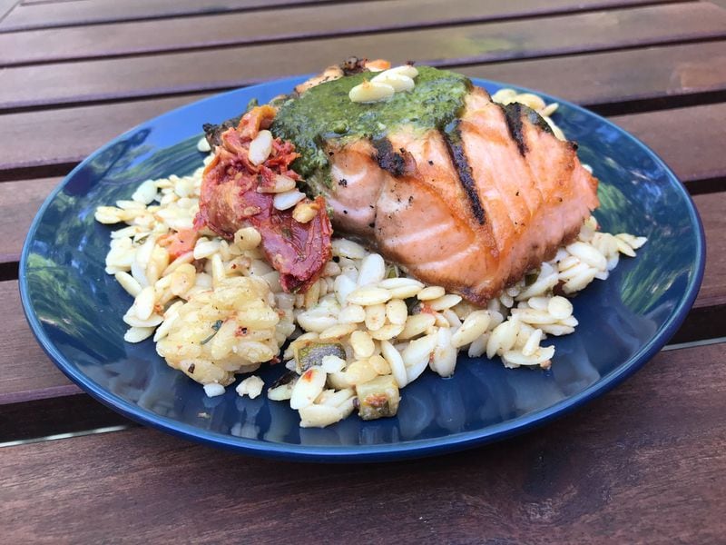 The grilled salmon from Osteria Mattone is served with warm orzo salad. LIGAYA FIGUERAS / LIGAYA.FIGUERAS@AJC.COM