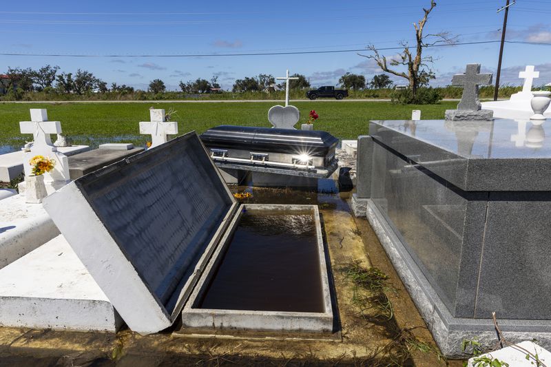 A casket floated out of the ground at a cemetery from waters brought on by Hurricane Francine, Thursday, Sept. 12, 2024, in Terrebonne Parish, La. (Chris Granger/The Times-Picayune/The New Orleans Advocate via AP)