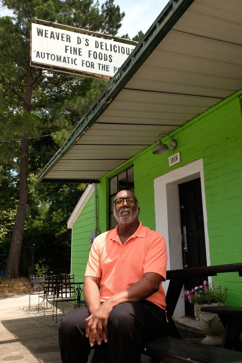 Dexter Weaver poses outside of his restaurant, Weaver D's. The slogan at the soul food restaurant Weaver was the inspiration for R.E.M.'s 1992 album "Automatic for the People". The restaurant opened in 1986 and has long been a favorite of local musicians and students.