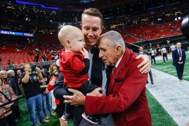 Atlanta Falcons owner Arthur Blank (right) greets former Falcons quarterback Matt Ryan and his son Cal, 1, before the Falcons faced the Tampa Bay Buccaneers on Thursday, October 3, 2024, at Mercedes-Benz Stadium in Atlanta. Ryan was inducted into the team's Ring Of Honor at halftime.
(Miguel Martinez/ AJC)