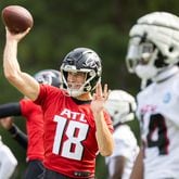 Falcons quarterback Kirk Cousins (18) practices during training camp at the Falcons’ headquarters in Flowery Branch on Friday, July 26, 2024. (Arvin Temkar / AJC)