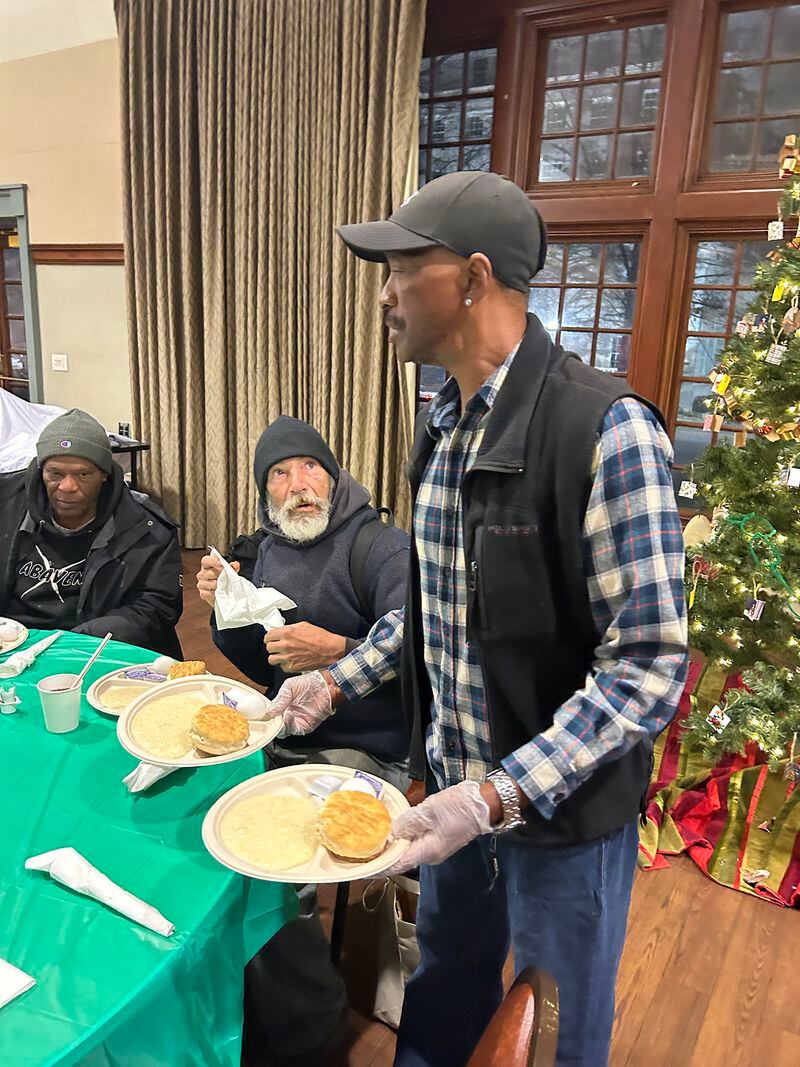 James Simmons of Redemption After Prison serves food at the Sunday morning prayer breakfast for the homeless and hungry at First Presbyterian Church of Atlanta. (Gayle White for The Atlanta Journal-Constitution)