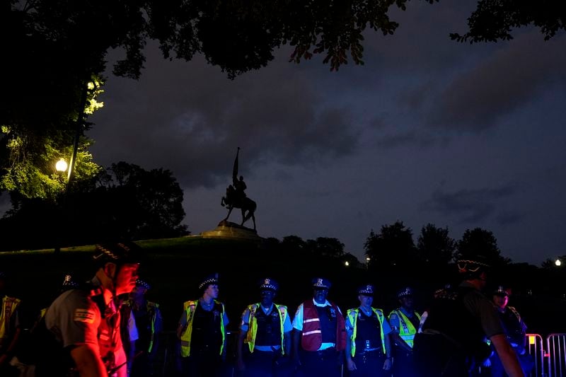 A police line goes around a monument to John Alexander Morgan in Grant Park prior to the start of the Democratic National Convention Sunday, Aug. 18, 2024, in Chicago. (AP Photo/Frank Franklin II)