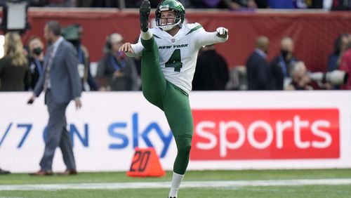 New York Jets punter Thomas Morstead (4) kicks the ball during the warm-up before an NFL football game between the New York Jets and the Atlanta Falcons at the Tottenham Hotspur stadium in London, England, Sunday, Oct. 10, 2021. (AP Photo/Alastair Grant)