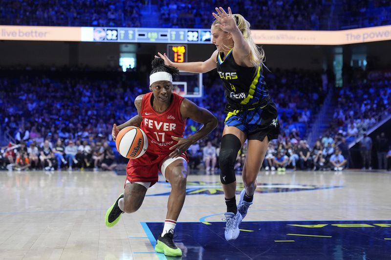 Indiana Fever guard Erica Wheeler (17) works to the basket as Dallas Wings' Jacy Sheldon (4) defends in the first half of a WNBA basketball game Sunday, Sept. 1, 2024, in Arlington, Texas. (AP Photo/Tony Gutierrez)