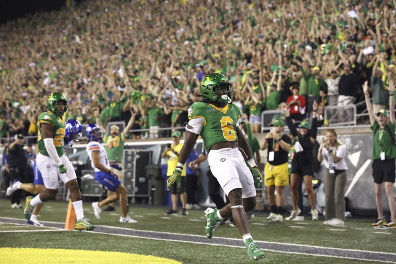 Oregon running back Noah Whittington (6) reacts to his 35-yard punt return during the second half of an NCAA college football game against Boise State, Saturday, Sept. 7, 2024, at Autzen Stadium in Eugene, Ore. (AP Photo/Lydia Ely)