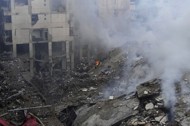 Smoke rises from the site of an Israeli airstrike in Beirut's southern suburb, Lebanon, Tuesday, Oct. 1, 2024. (AP Photo/Hassan Ammar)