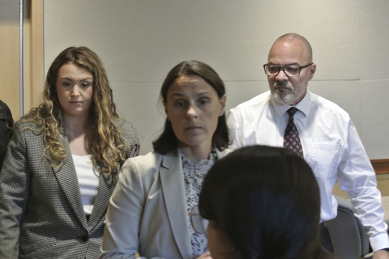 Victor Malavet, right, stands with defense attorneys Zosia Buse, left, and Jaye Duncan, center, as the judge directs the jury to continue with deliberations before later declaring a mistrial, Tuesday, Sept. 3, 2024, at Merrimack County Superior Court, in Concord, N.H. (Damien Fisher/InDepthNH via AP, Pool)