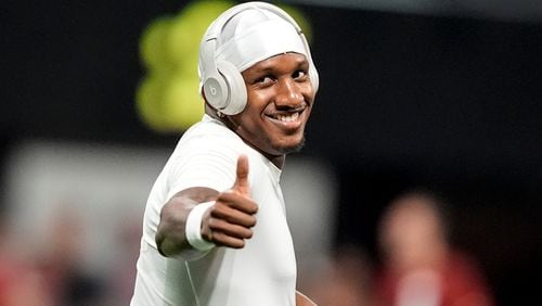 Atlanta Falcons quarterback Michael Penix Jr. warms up before an NFL football game between the Atlanta Falcons and the Kansas City Chiefs, Sunday, Sept. 22, 2024, in Atlanta. (AP Photo/Brynn Anderson)