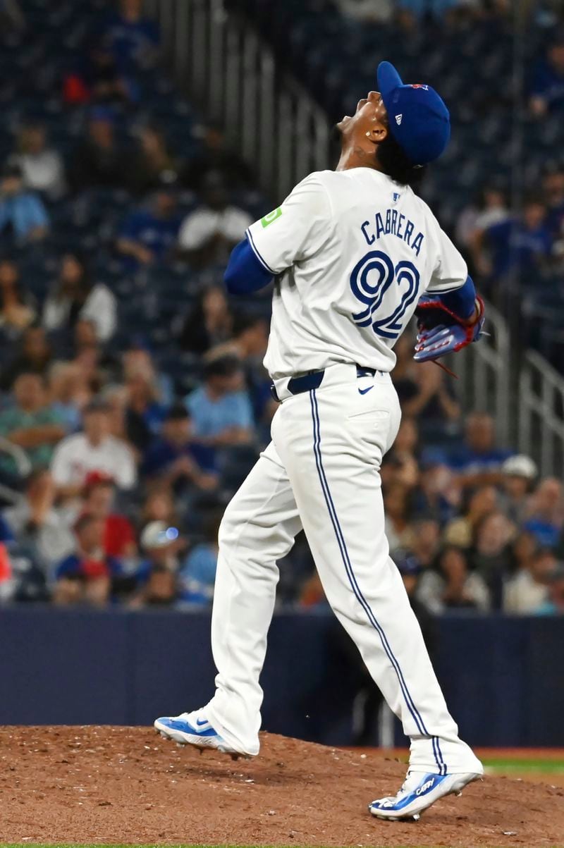 Toronto Blue Jays pitcher Genesis Cabrera (92) reacts to the final out of the eighth inning of a baseball game against the Philadelphia Phillies,in Toronto on Tuesday Sept. 3, 2024. (Jon Blacker/The Canadian Press via AP)