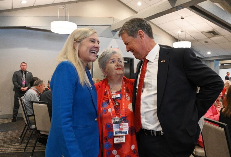 Gov. Brian Kemp (right) and first lady Marty Kemp (left) are greeted by Nancy Burton, delegate from Walker County, as they arrive for an event with Georgia delegates attending the Republican National Convention. 