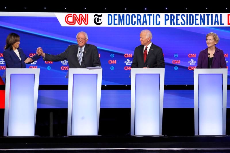 FILE - Democratic presidential candidate Sen. Kamala Harris, D-Calif., from left, Sen. Bernie Sanders, I-Vt., former Vice President Joe Biden and Sen. Elizabeth Warren, D-Mass., participate in a Democratic presidential primary debate, Oct. 15, 2019, in Westerville, Ohio. (AP Photo/John Minchillo, File)