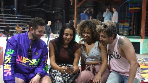 Sharing a moment during rehearsals are Kameron Lopreore (from left) and Amanda Batista, who sing the roles of Rodolfo and Mimi in "La Boheme," and Chani Maisonet and Heath Saunders, their counterparts in "Rent."
Courtesy of The Atlanta Opera Film Studio