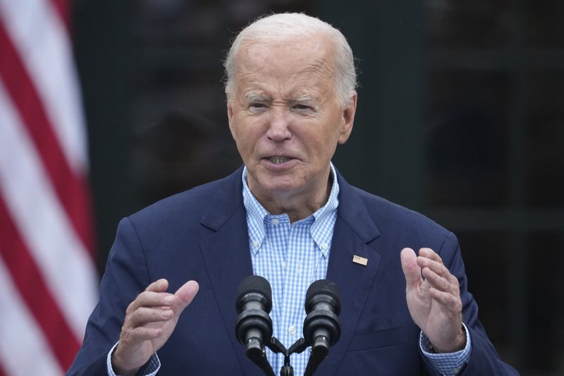 President Joe Biden speaks to active-duty military service members and their families during a Fourth of July celebration and barbecue on the South Lawn of the White House in Washington, Thursday, July 4, 2024. (AP Photo/Susan Walsh)