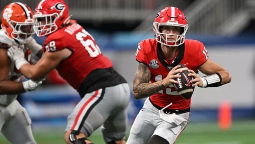 Georgia quarterback Carson Beck (15) runs with the ball during the second half in an NCAA football game at Mercedes-Benz Stadium, Saturday, August 31, 2024, in Atlanta. Georgia won 34-3 over Clemson. (Hyosub Shin / AJC)