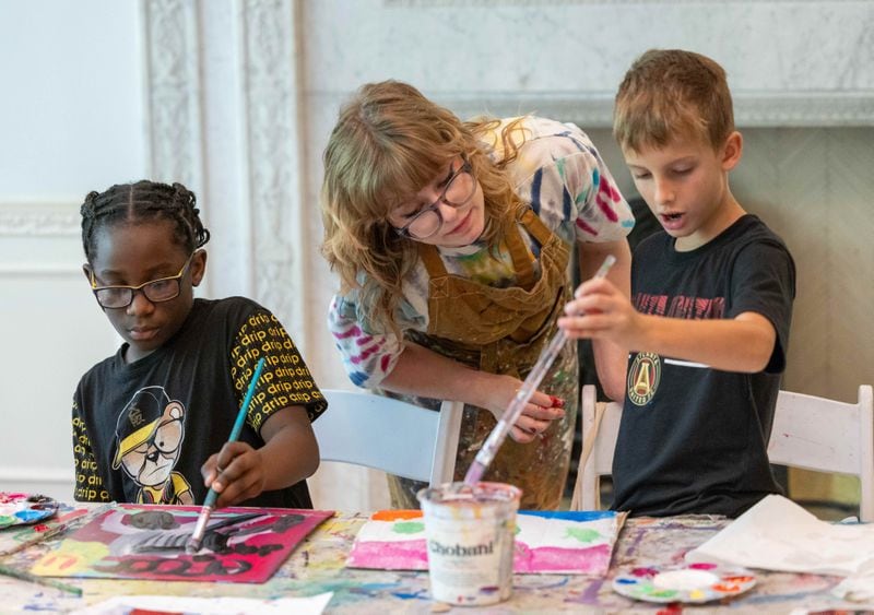 (l-r)  Kevin Jones works on his painting as teacher Ella Kimberly helps William Moravian with his during a summer camp at Callanwolde Fine Arts Center. PHIL SKINNER FOR THE ATLANTA JOURNAL-CONSTITUTION