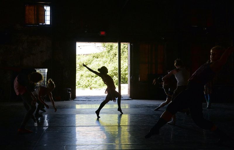 Glo dancers rehearse “Cloth” at the Goat Farm in Atlanta. Brant Sanderlin/bsanderlin@ajc.com