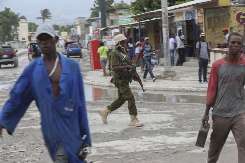 A Kenyan police officer patrols an area near the international airport in Port-au-Prince, Haiti, Wednesday, July 3, 2024. (AP Photo/Odelyn Joseph)