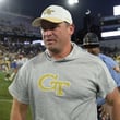 Georgia Tech coach Brent Key leaves the field after the Yellow Jackets beat Duke 23-20 in overtime Oct. 8, 2022 at Bobby Dodd Stadium. (Daniel Varnado/For the AJC)