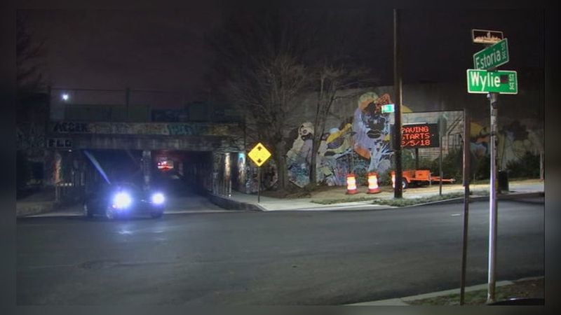Atlanta police are searching for a carjacker who jumped out of a cargo space as a woman was driving and stole her SUV near the Krog Street Tunnel. (Credit: Channel 2 Action News)