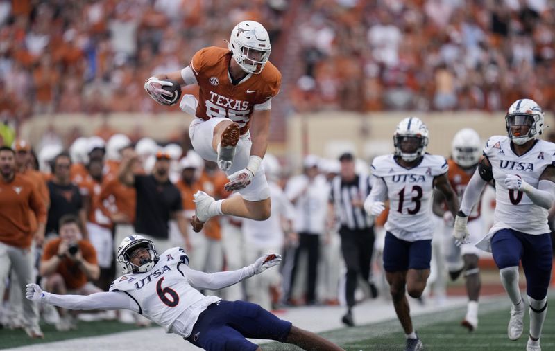 Texas tight end Gunnar Helm (85) lea[ps over UTSA safety Elliott Davison (6) during the first half of an NCAA college football game in Austin, Texas, Saturday, Sept. 14, 2024. (AP Photo/Eric Gay)