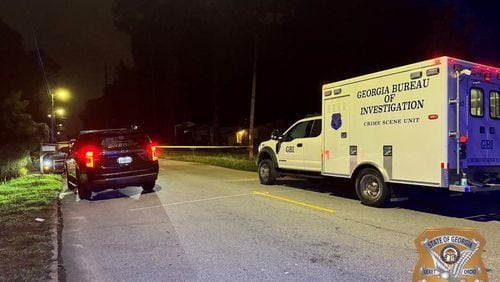 The GBI is investigating after a Fulton County sheriff's deputy shot a man suspected of driving a stolen SUV and then brandishing a gun after being pulled over late Tuesday.