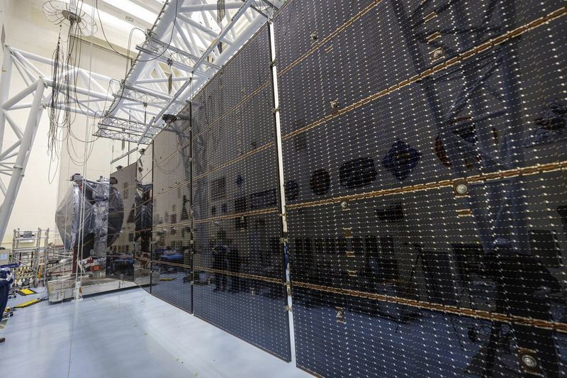 In this image released by NASA, NASA’s Europa Clipper is seen here on Aug. 21, 2024, at the agency’s Kennedy Space Center in Florida. Engineers and technicians deployed and tested the giant solar arrays to be sure they will operate in flight. (Frank Michaux/NASA via AP)