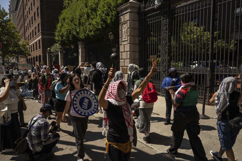 Pro-Palestinian supporters hold picket line outside Barnard College, Tuesday, Sept. 3, 2024, in New York. (AP Photo/Yuki Iwamura)