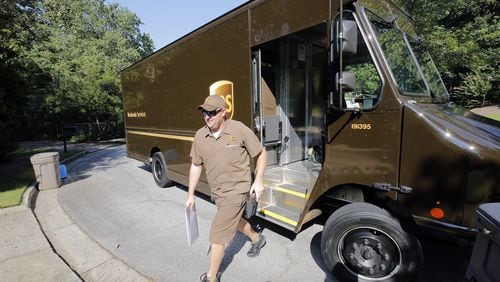 Driver Dan Partyka delivers an overnight package last year. (Bob Andres/Atlanta Journal-Constitution/TNS)