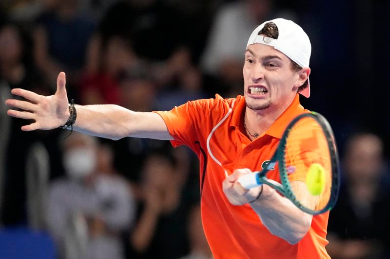 Ugo Humbert of France plays a forehand return against Arthur Fils of France during their men's singles final match at the Japan Open tennis tournament on Tuesday, Oct. 1, 2024, at Ariake Coliseum, in Tokyo, Japan. (AP Photo/Eugene Hoshiko)