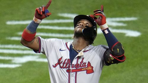 Atlanta Braves' Ronald Acuña Jr. celebrates as he crosses home plate on a three-run home run off Pittsburgh Pirates starting pitcher Bailey Falter during the eighth inning of a baseball game in Pittsburgh, Friday, May 24, 2024. (AP Photo/Gene J. Puskar)