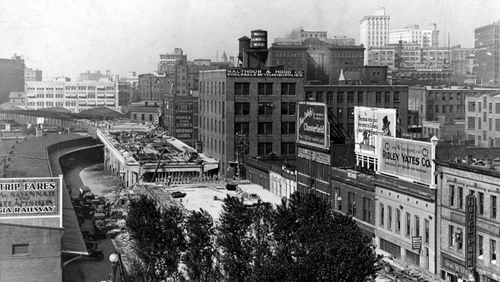 Construction of the Spring Street viaduct sometime around 1920, one of the major projects for a growing Atlanta, meant that older infrastructure such as existing water mains needed replacing. (File)