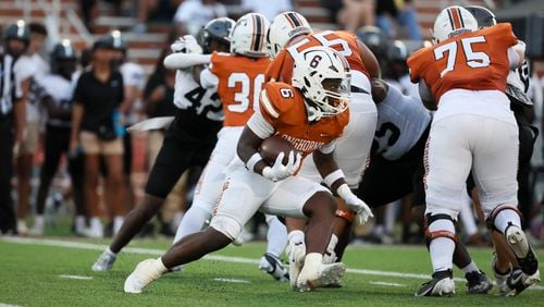 Kell running back Moonie Gipson (6) runs for yards against North Atlanta during the first half of the Corky Kell Dave Hunter Classic at Kell High School, Wednesday, August 14, 2024, in Marietta, Ga. (Jason Getz / AJC)
