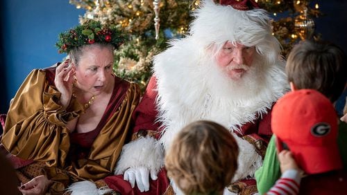 The first Town Green Lighting will take place at 6 p.m. Nov. 28 in Avondale Estates. Here Santa and Mrs. Claus greet children during Winter Wanderland that is scheduled for noon to 5 p.m. Dec. 10 at participating businesses in the city. (Courtesy of Explore Avondale)