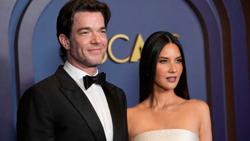 FILE - John Mulaney, left, and Olivia Munn arrive at the Governors Awards, Jan. 9, 2024, at the Dolby Ballroom in Los Angeles. (AP Photo/Chris Pizzello, File)