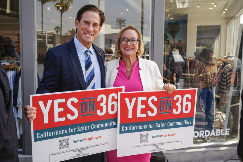 Nathan Hochman, a candidate for attorney general of California, left, and Los Angeles City Council member Traci Park, gather a coalition of Los Angeles area elected leaders, public safety officials and business leaders to announce their support for Proposition 36 on the November ballot at a news conference in the Venice district of Los Angeles, Monday, Sept. 30, 2024. (AP Photo/Damian Dovarganes)