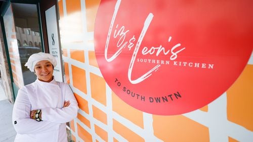 Chef Bella Jones poses for a photograph outside her establishment, Liz and Leon‚Äôs Southern Kitchen, in downtown Atlanta on Wednesday, Dec. 20, 2023.
Miguel Martinez /miguel.martinezjimenez@ajc.com