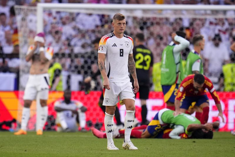 Germany's Toni Kroos walks off the pitch after a quarter final match between Germany and Spain at the Euro 2024 soccer tournament in Stuttgart, Germany, Friday, July 5, 2024. (AP Photo/Manu Fernandez)