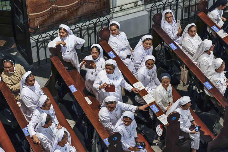 Nuns wait for the arrival of Pope Francis at the Jakarta Cathedral in Jakarta, Indonesia, Wednesday, Sept. 4, 2024. (Yasuyoshi Chiba /Pool Photo via AP)