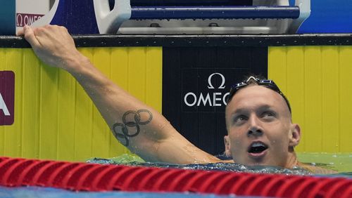 Caeleb Dressel reacts after the men's 100 butterfly semifinals heat Friday, June 21, 2024, at the US Swimming Olympic Trials in Indianapolis. (AP Photo/Michael Conroy)