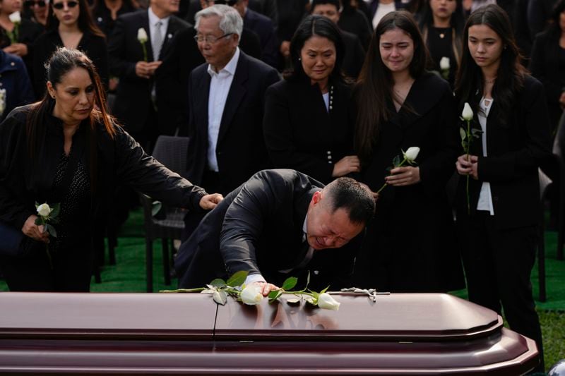 Kenji Fujimori mourns during the funeral of his father, former President Alberto Fujimori, in Lima, Peru, Saturday, Sept. 14, 2024. (AP Photo/Guadalupe Pardo)