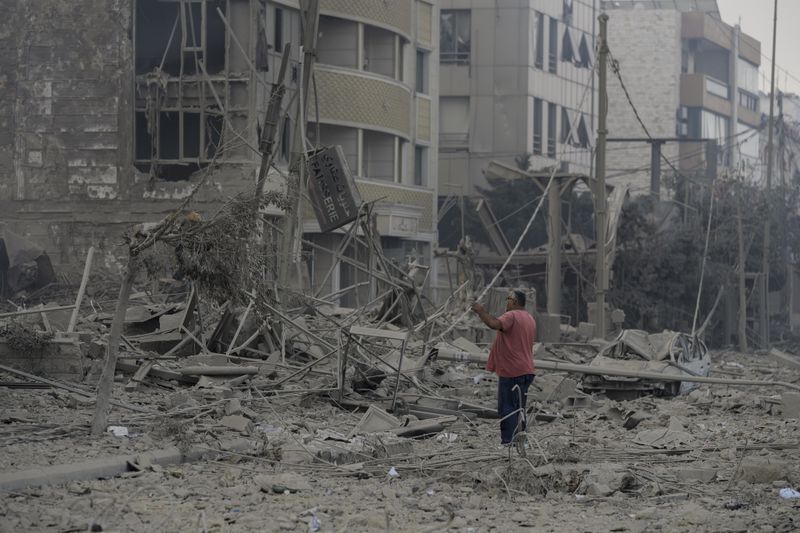 A man checks the site of an Israeli airstrike in Dahiyeh, Beirut, Lebanon, Sunday, Oct. 6, 2024. (AP Photo/Bilal Hussein)