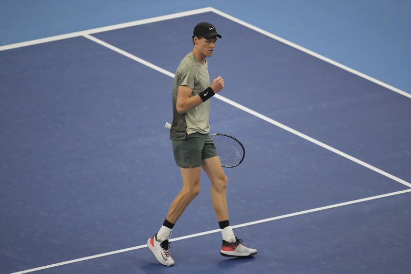 Italy's Jannik Sinner celebrates scoring a point during the ball during the China Open tennis tournament men's singles semi-final match against China's Bu Yunchaokete, at the National Tennis Center in Beijing, Tuesday, Oct. 1, 2024.(AP Photo/Achmad Ibrahim)