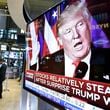 FILE - An image of President-elect Donald Trump appears on a television screen on the floor of the New York Stock Exchange, Nov. 9, 2016. (AP Photo/Richard Drew, File)